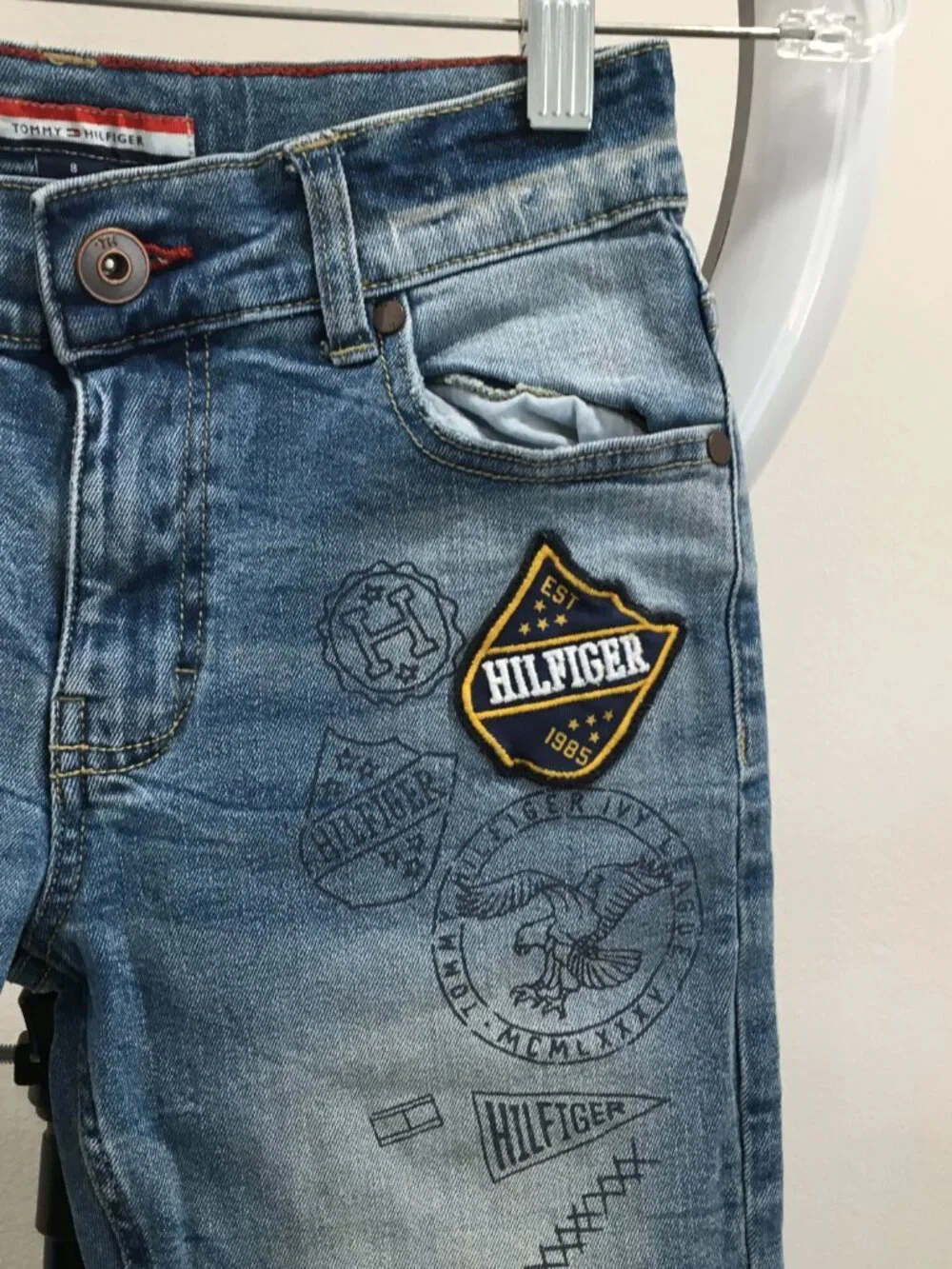 TOMMY HILFIGER Distressed Cut Step Hem Adj Waist Distressed Applique Logo Jeans